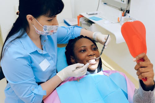 a woman smiling during a dental treatment